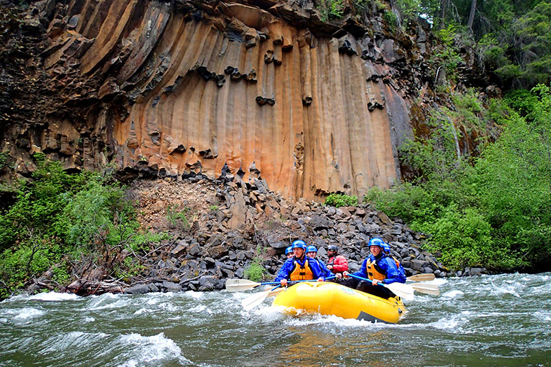 Rafters float by Basalt Formations on the Klickitat RIver. Wet Planet Whitewater