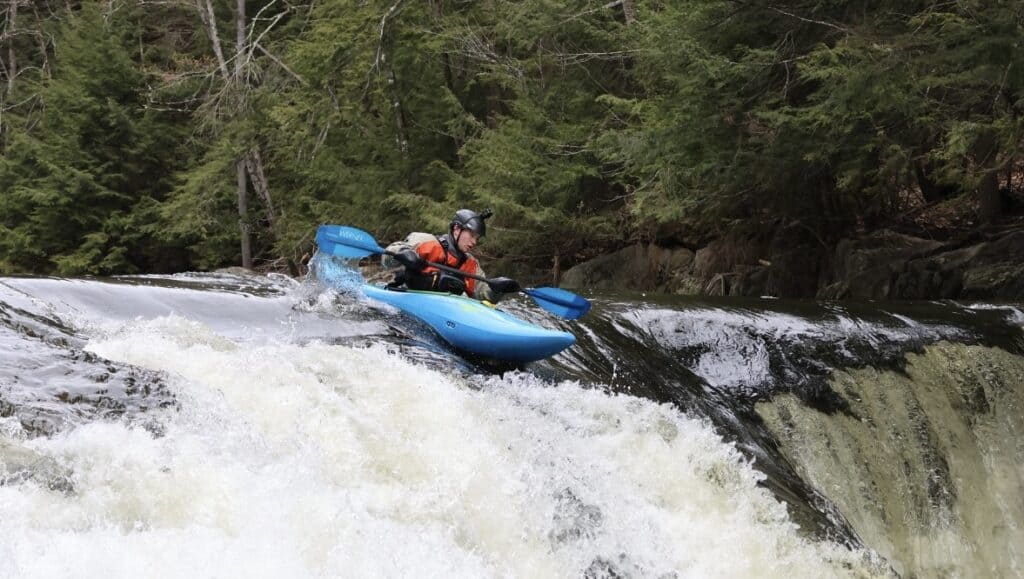 guy-kayaking-rapids