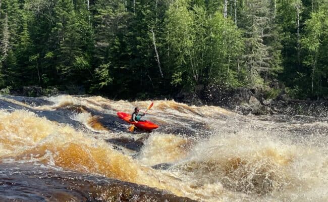 female-kayaker-on-rapids