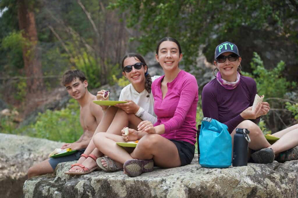 Family having a riverside lunch on the Main Salmon River