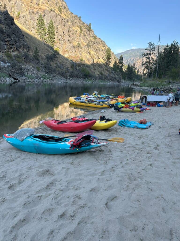 Rafts and whitewater kayaks on the river banks of the Main Salmon River