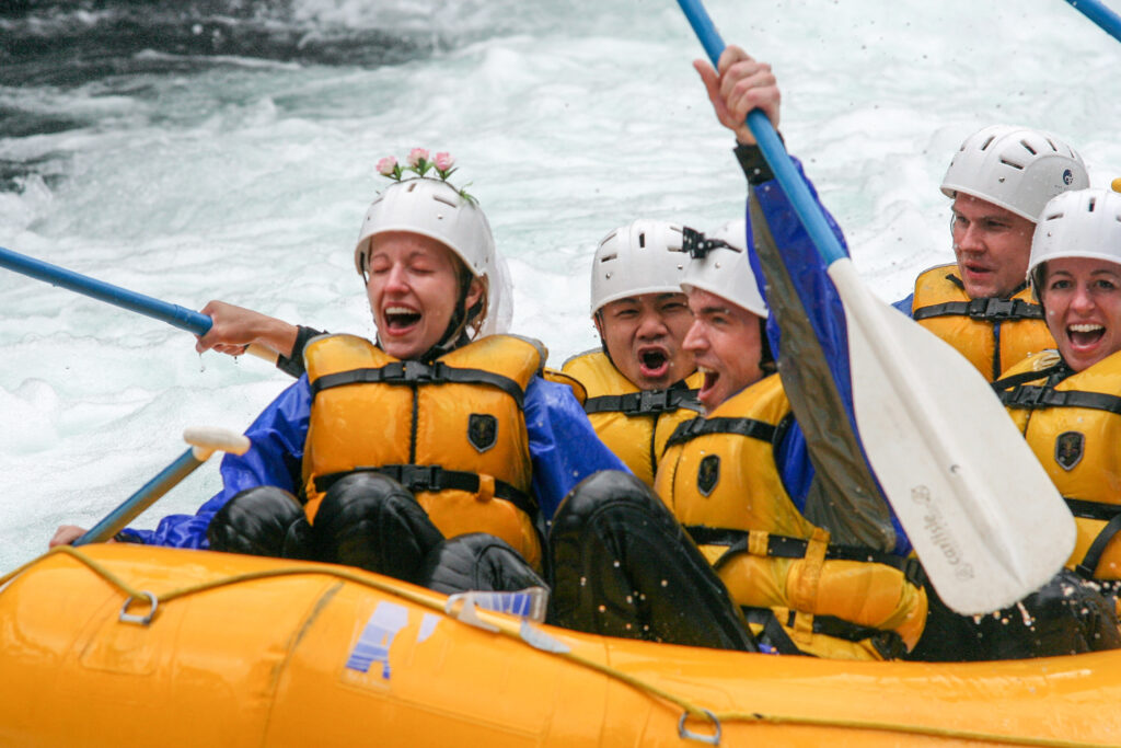 wedding couple celebrating whitewater rafting