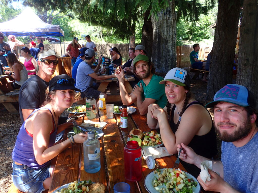 Wedding group eating after rafting