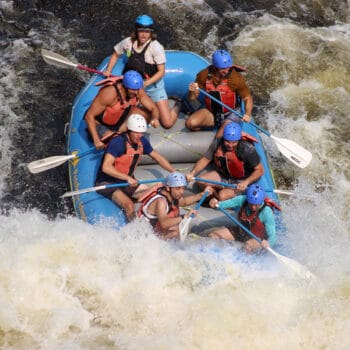 Action photo of Adelaide Brant whitewater raft guiding.