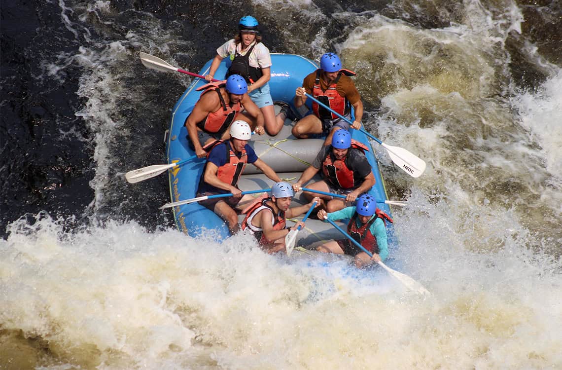 Action photo of Adelaide Brant whitewater raft guiding.