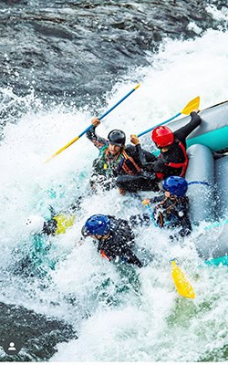 Action shot of Eric Ortiz whitewater rafting.