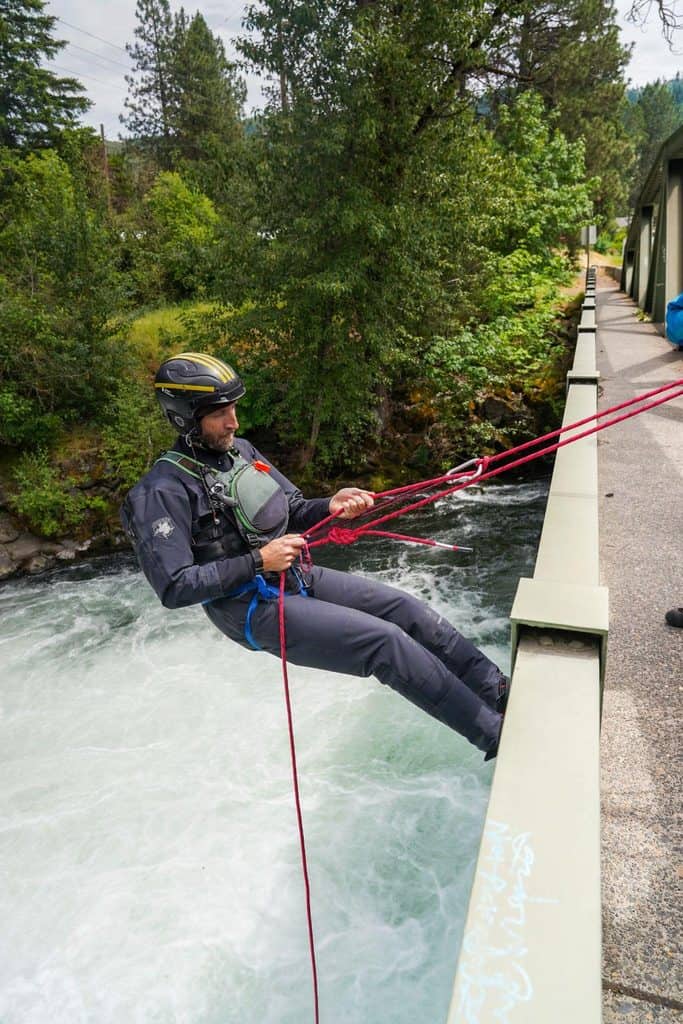 River rescue training. Rope rappel from bridge