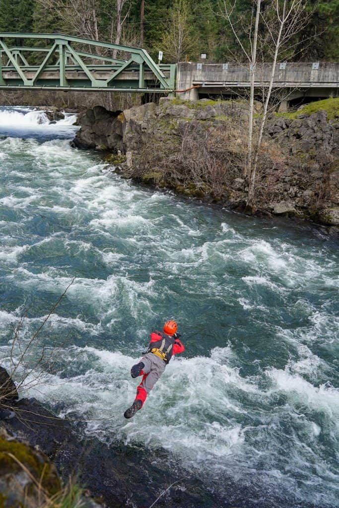 Swiftwater rescue training, diving into river