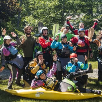 A group of kayak instructors poses with silly faces at the end of the ACA kayak instructor course.