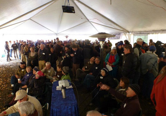 Hundreds of people gathered around 5 screens under the big tent to watch Condit Dam BLOW!