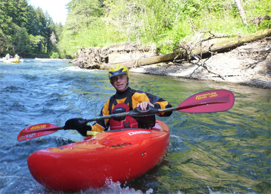 Dave Steindorf, Stweardship Director with American Whitewater, enjoys the river from a kayak.