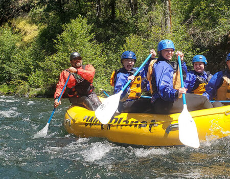 Group of rafters smiling on the river