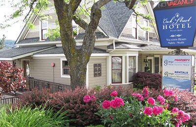 Side view of Oak Street Hotel with garden in front. Wet Planet Whitewater in Washington, Idaho, Oregon