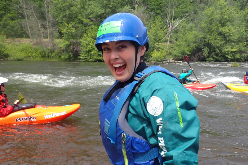 Woman is Having Fun Whitewater Kayaking. Wet Planet Whitewater