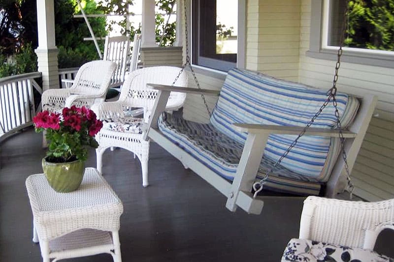 Old fashioned porch with chair swing at the Gorge View Bed and Breakfast. Wet Planet Whitewater in Washington, Idaho, Oregon