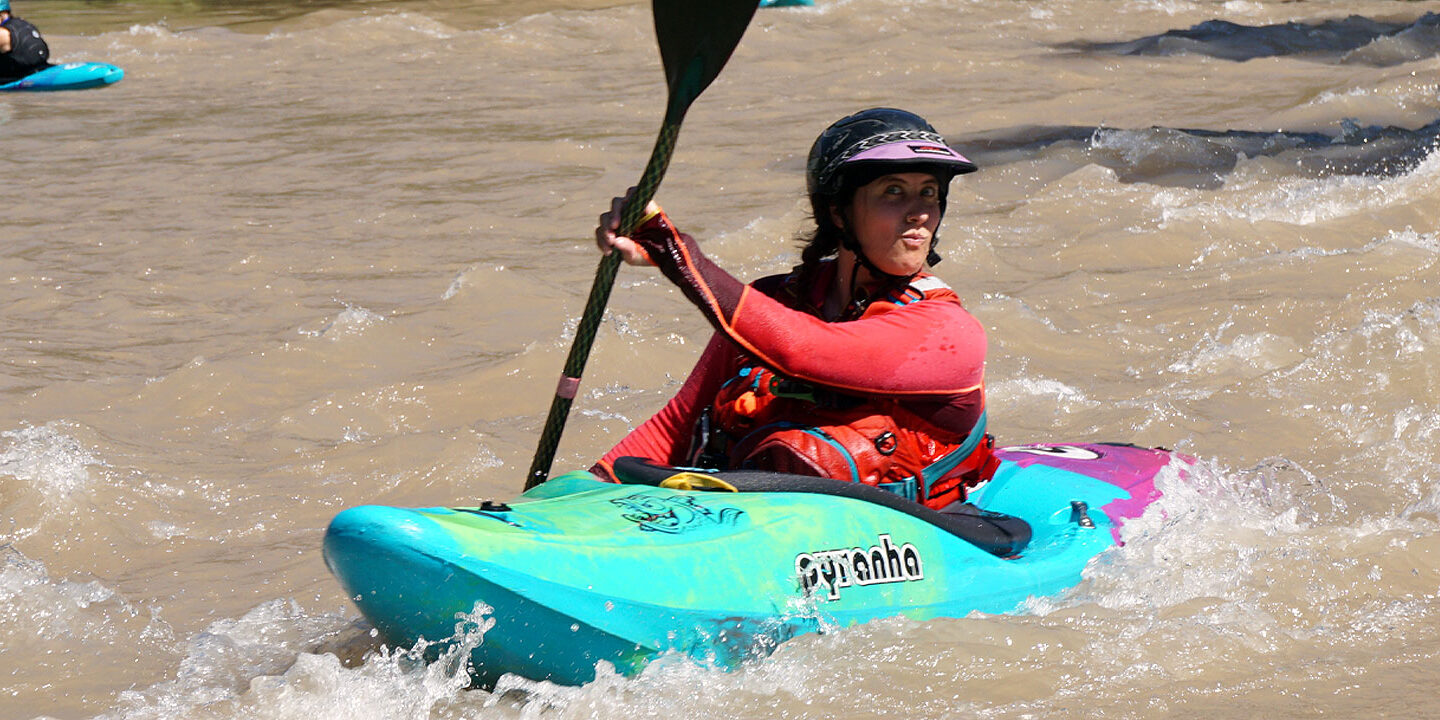 Female kayaker making a funny face on the river