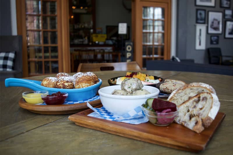 Breakfast foods including Danish pancakes and Swedish Meatballs are served at Broder Ost restaurant at Hood River Hotel