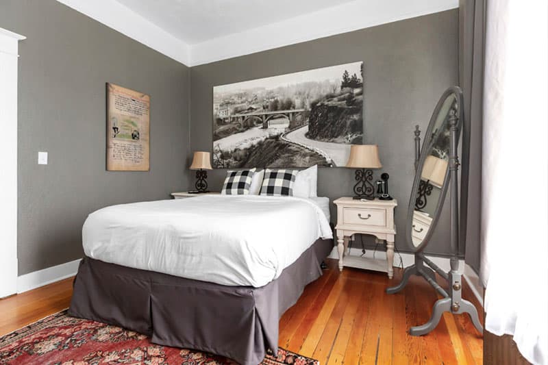 Cozy bedroom with western theme at the Hood River Hotel. Wet Planet Whitewater in Washington, Idaho, Oregon