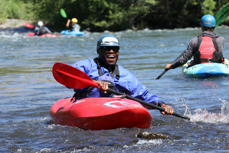 Man is learning to kayak during an intro course. Wet Planet Whitewater