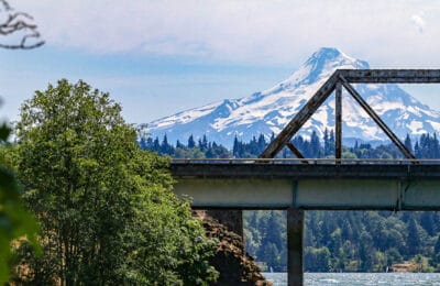 Bridge with snowcapped mountain background in Washington. Wet Planet Whitewater in Washington, Idaho, Oregon
