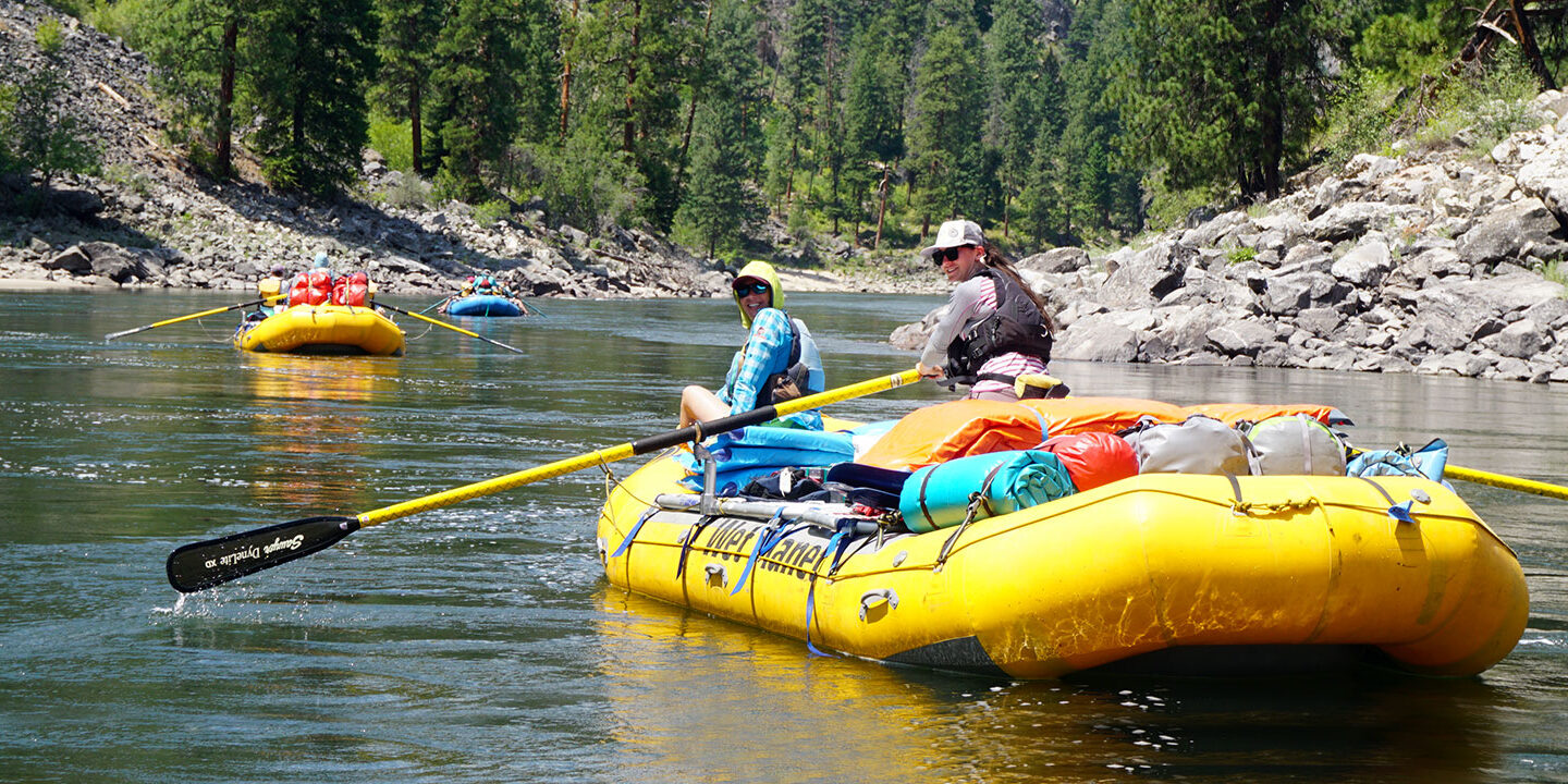 Two people smiling on a multi-day raft on the Main Salmon river