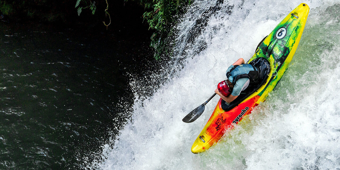 Kayaker sending it down a waterfall