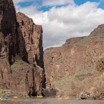 A group of rafts floats into the entrance to the Green Dragon Canon on day four of a five day multi-day adventure on Oregon's Owyhee River.