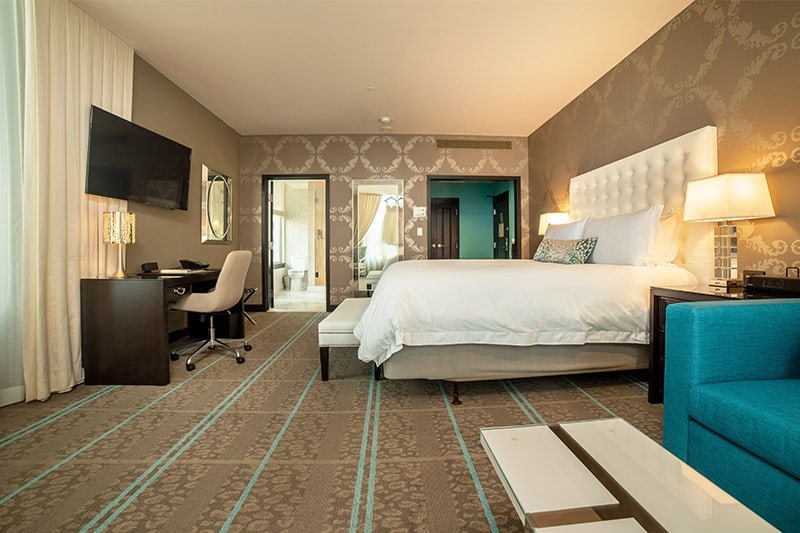 Modern teal and white design in guest room at The Nines Portland. Wet Planet Whitewater in Washington, Idaho, Oregon