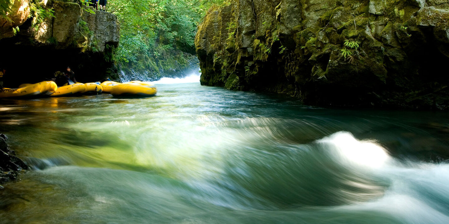 Rafts in an eddy in a canyon along the river