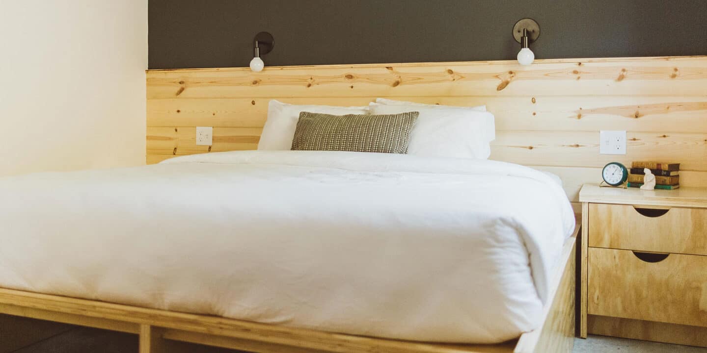 Modern wood furnishings in a bedroom of the Society Hotel Bingen Wet Planet Whitewater in Washington, Idaho, Oregon