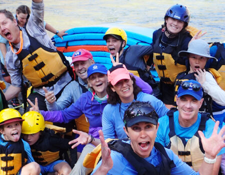 Families making funny faces on multi-day river trip