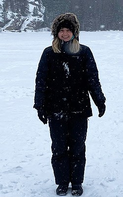 Kali Bennett stands in the snow.