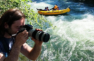 Photographer captures images of whitewater rafting customers as they raft down the river. Wet Planet Whitewater in Washington, Idaho, Oregon