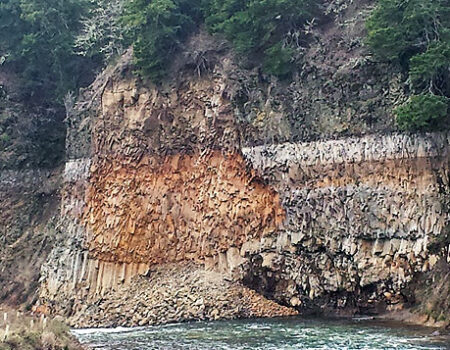 Large chunk of a cliff wall that broke off and fell into the White Salmon River