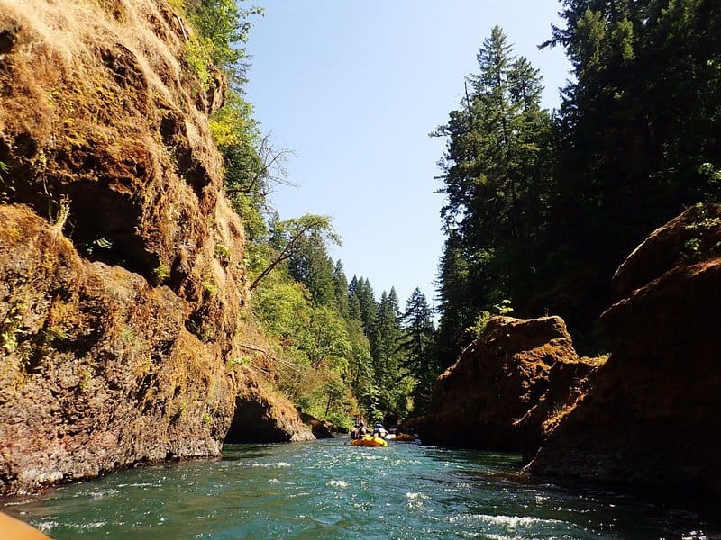 looking down the lower canyons at rafts on the white salmon river rafting trip