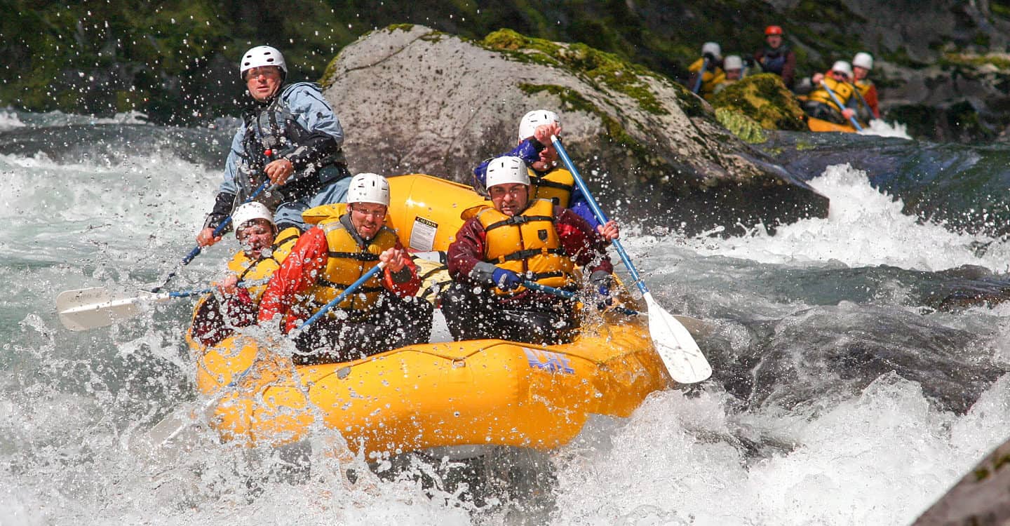 A rafting group paddles hard into Ram's Horn rapid on the Wind River in Washington